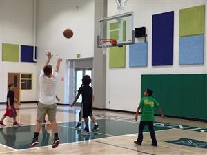 Students playing basketball during Saturday Explorer program 