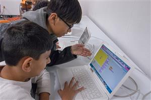 Saturday Explorers working on Scratch project 