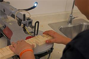 Student working on wood shop project 